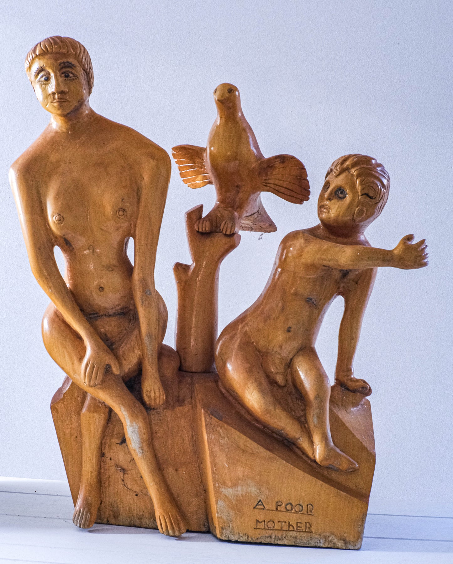 Large folk art piece carved from single block.